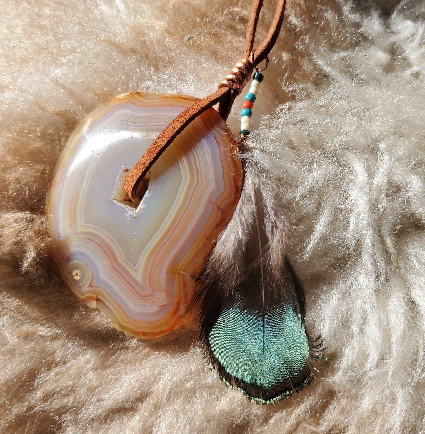 Banded Agate Window Display. SUNCATCHER. Copper wire. Ethically Sourced Pheasant Feather. Seed Beads. Leather. Meditation tool. - EarthyElementStudio