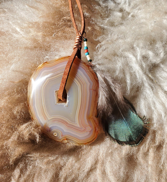 Banded Agate Window Display. SUNCATCHER.  Copper wire.  Ethically Sourced Pheasant Feather. Seed Beads. Leather. Meditation tool.